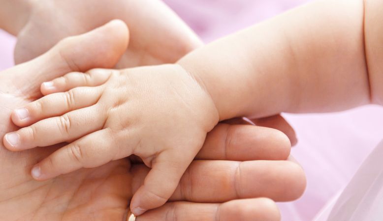 Close-up of gentle touch used in infant massage